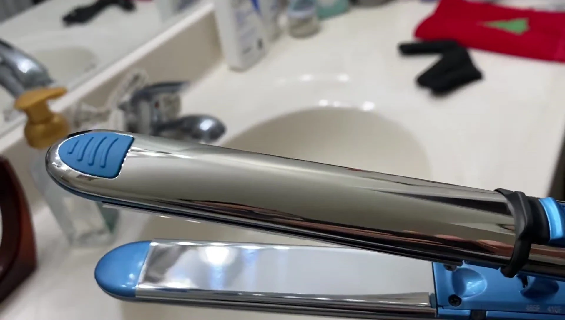 Close-up showcasing the dual heat technology of the Babyliss Pro Nano Titanium flat iron.