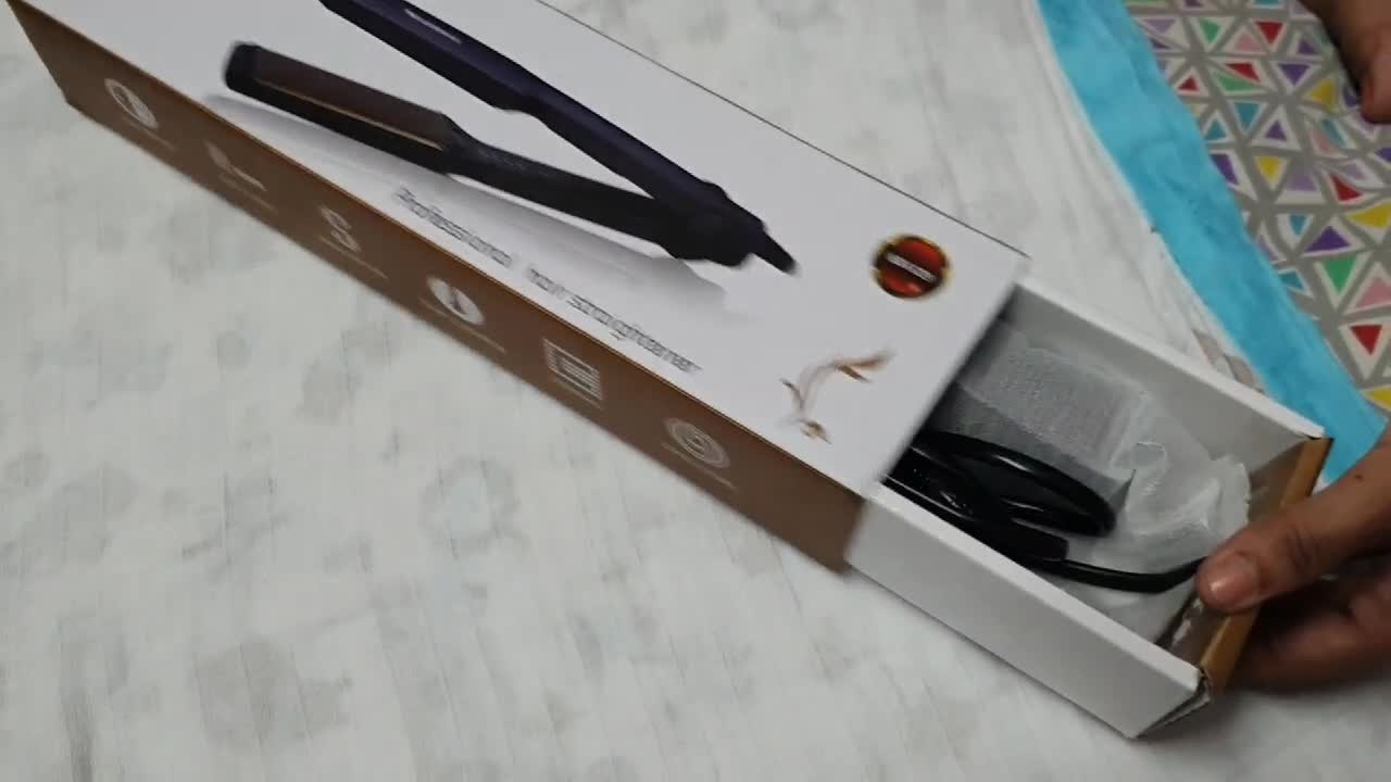 Shot showcasing the straightener's lightweight build and design.