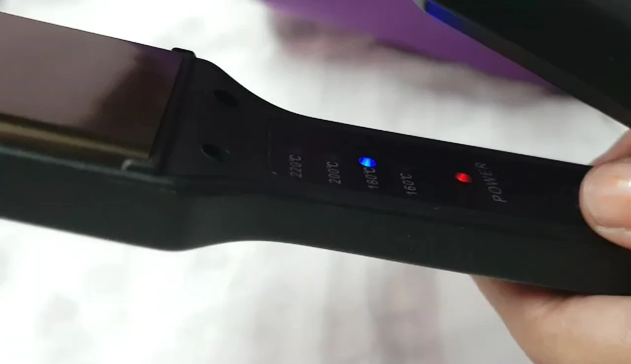 Image focusing on the ceramic plates of the hair straightener.
