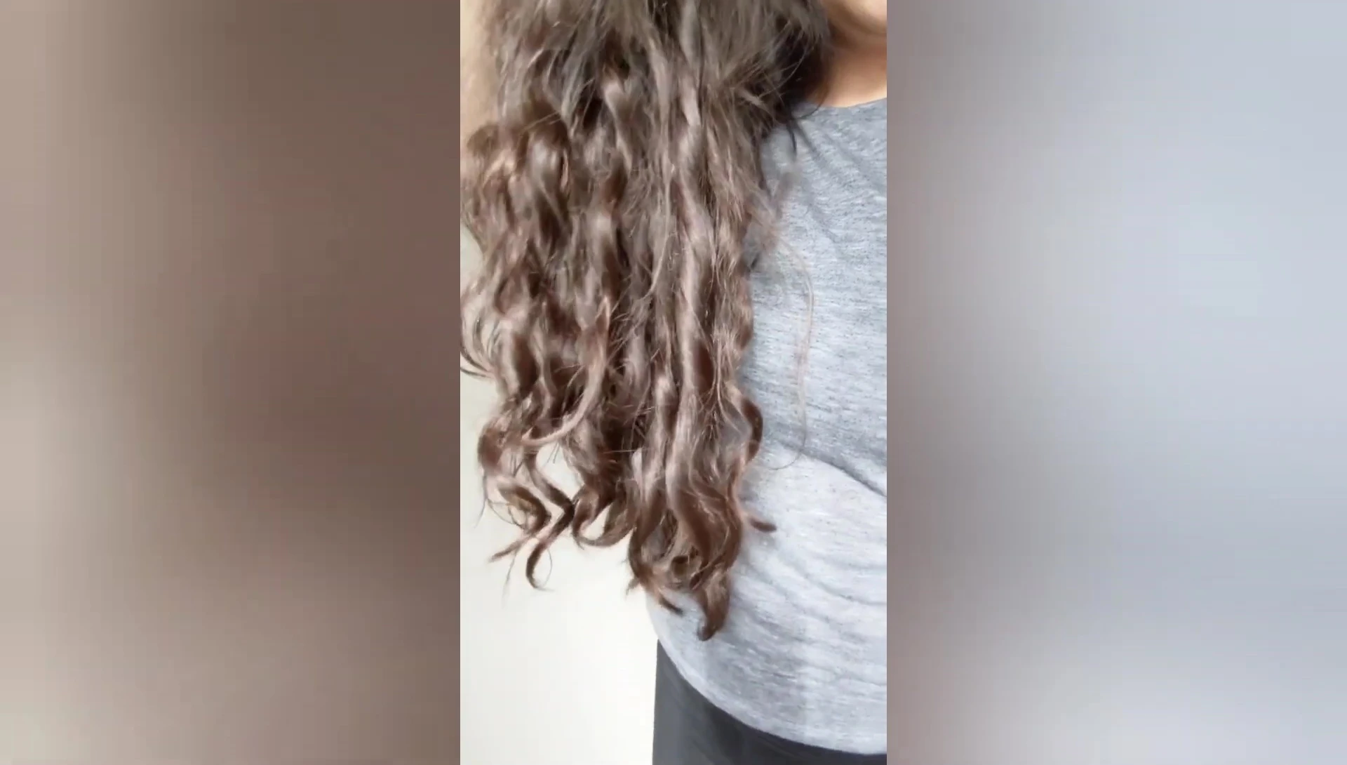 The reviewer's natural, frizzy hair before styling