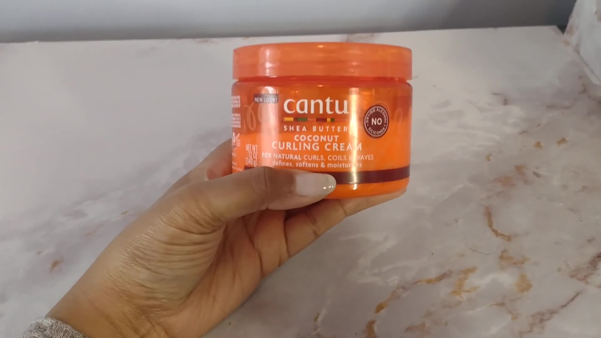 Close-up shot of the product's application on hair.