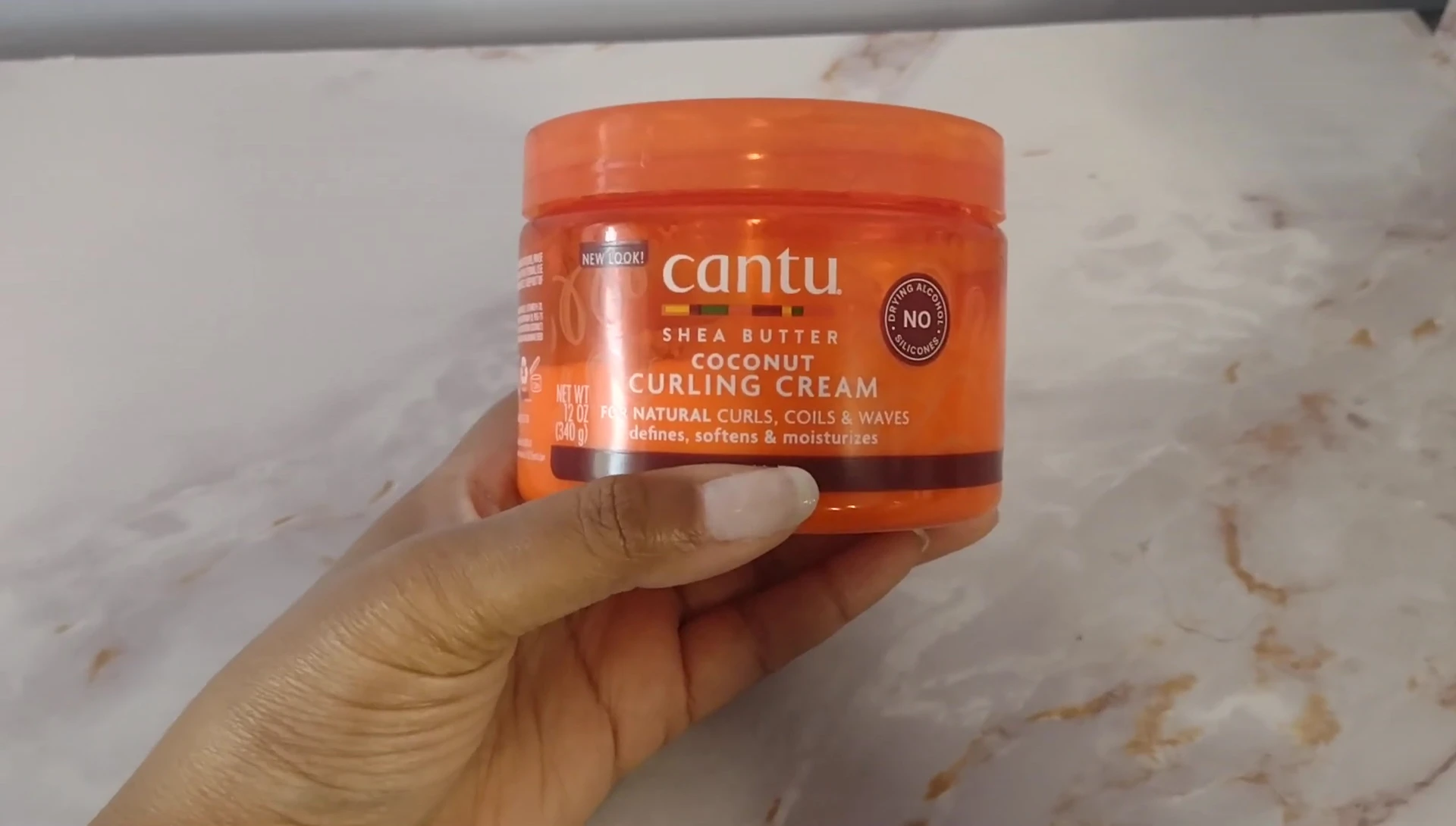 Shot displaying well-defined curls after product application.