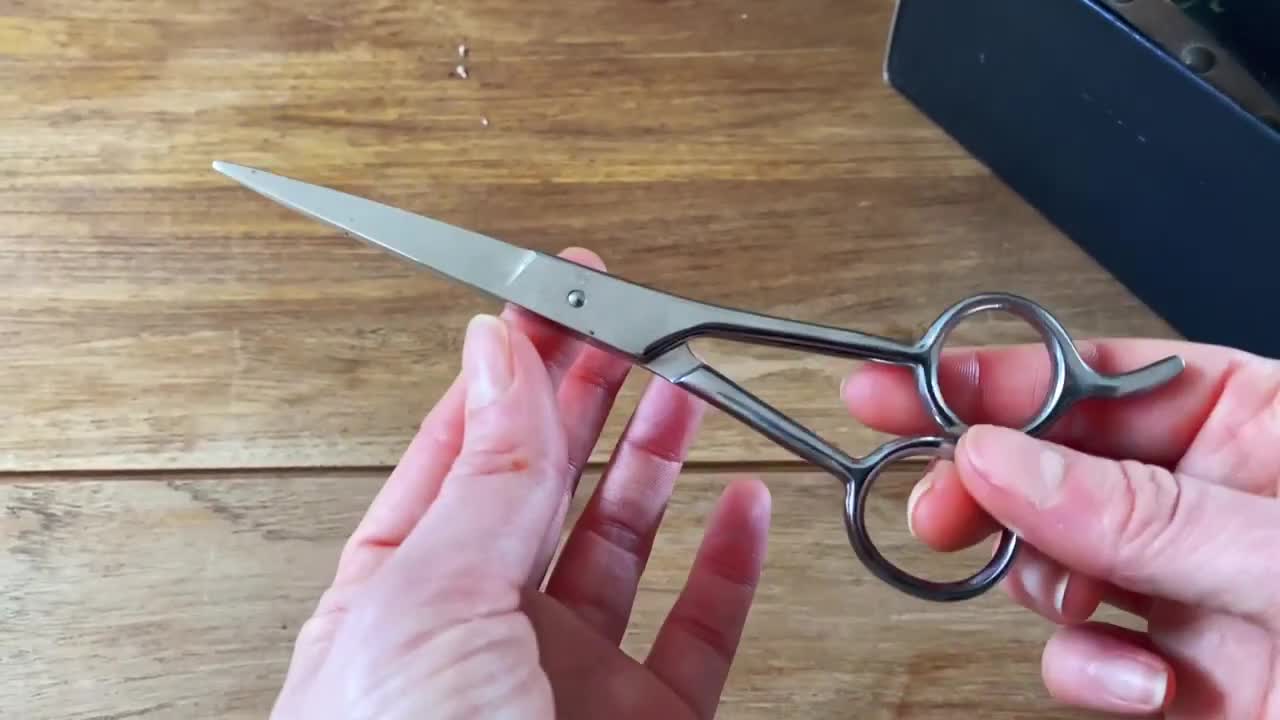 Scissors being used to cut hair