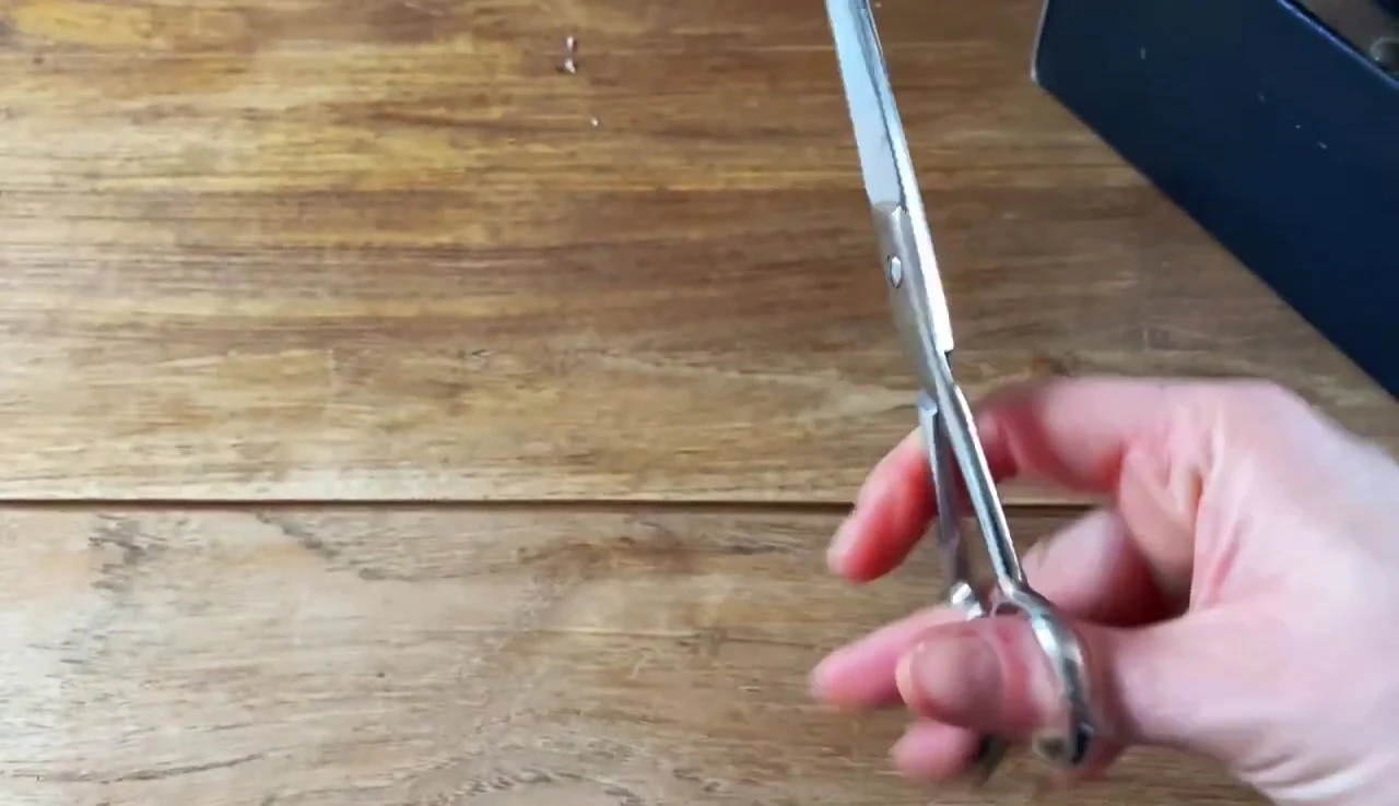 The user demonstrating the use of the finger holder