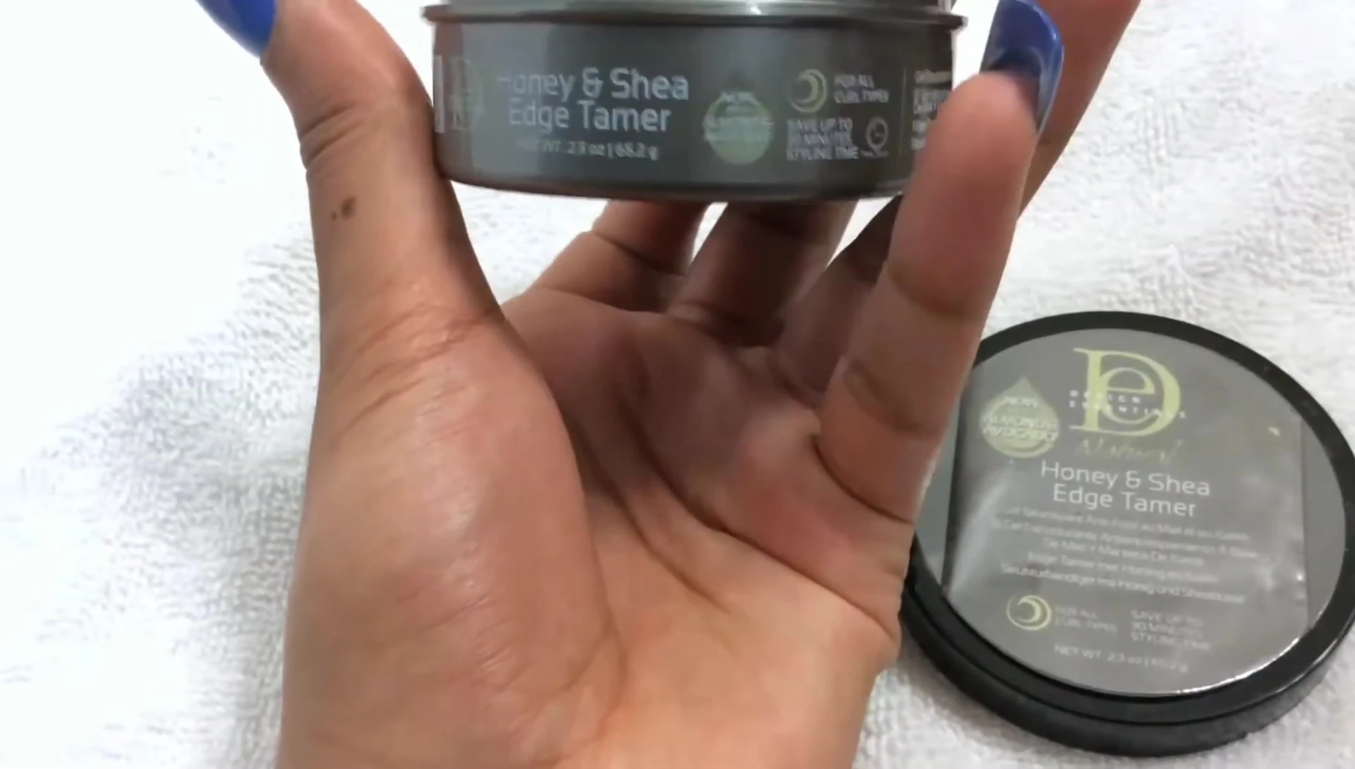 Close-up of the Design Essentials Natural Honey & Shea Edge Tamer jar.