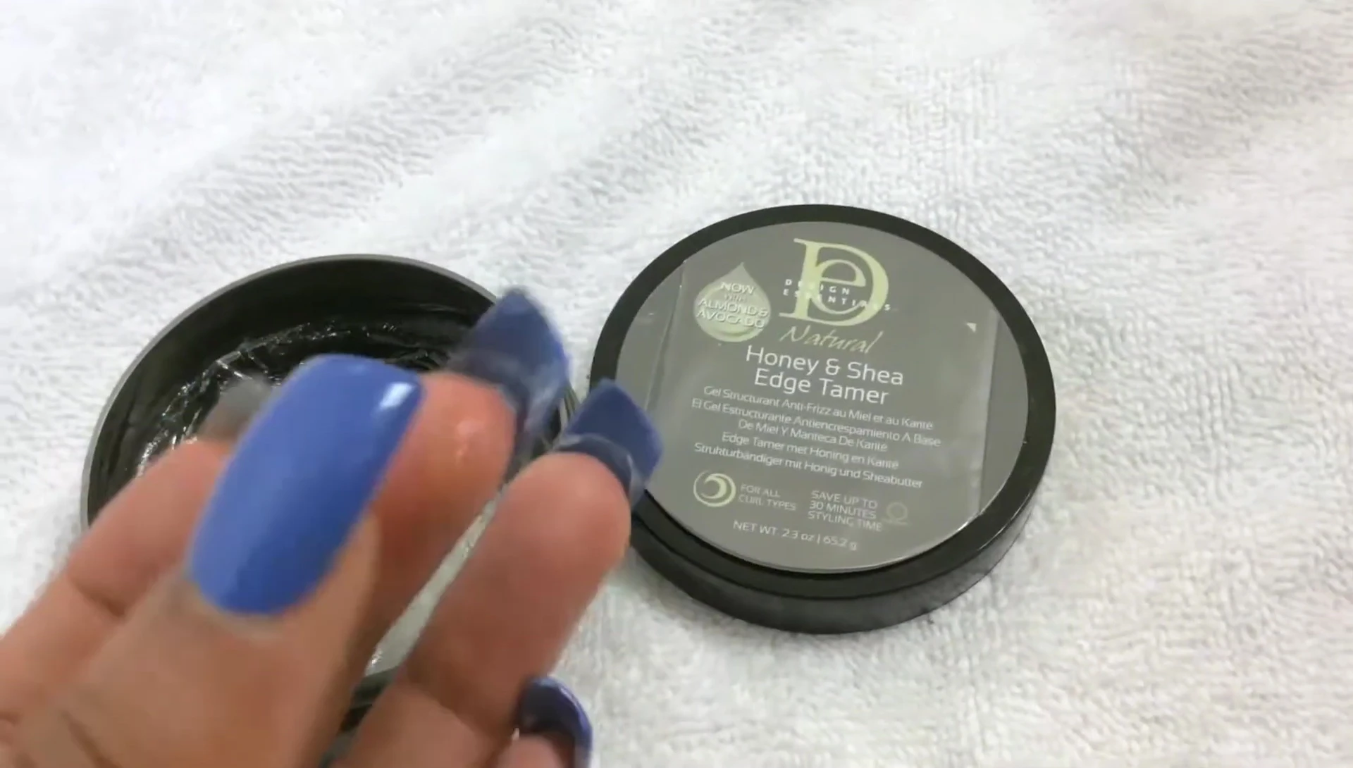 The reviewer showcasing the product's shine on their hairline.