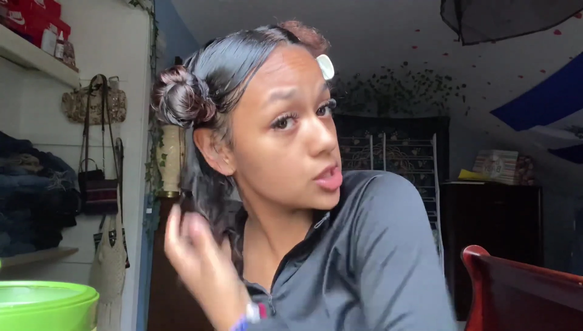 Vlogger applying gel to a section of hair