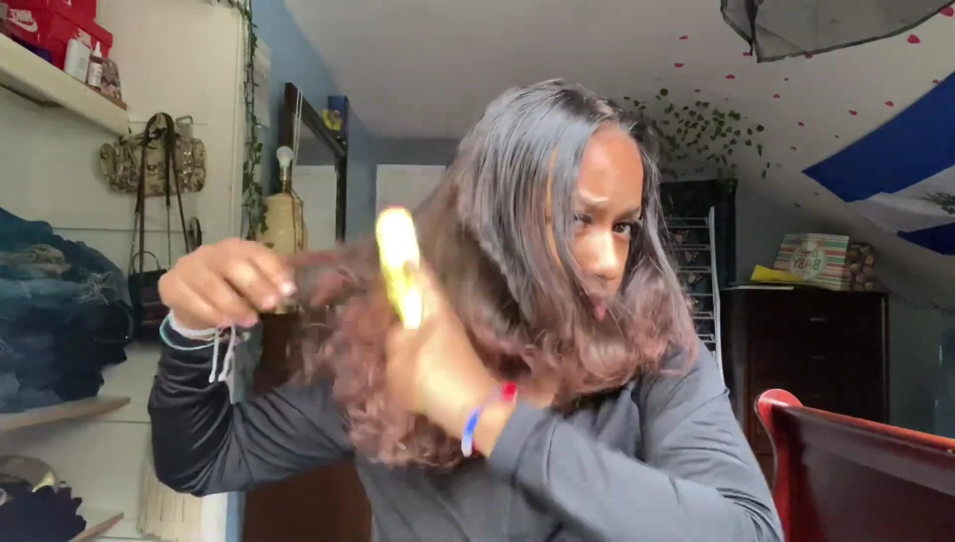 The vlogger brushing her hair