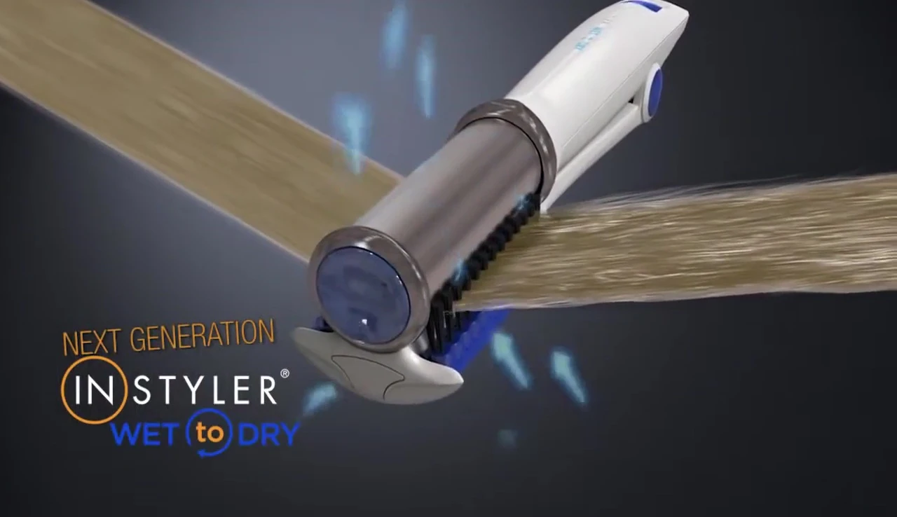 Image showing the rotating barrel removing excess water from the hair.